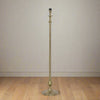Raw antique bronze lamp Tall and slender floor lamp with curved details.